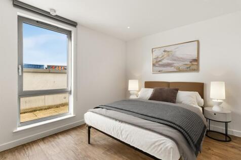 Experience tranquility in this chic bedroom, offering a blend of comfort and style.