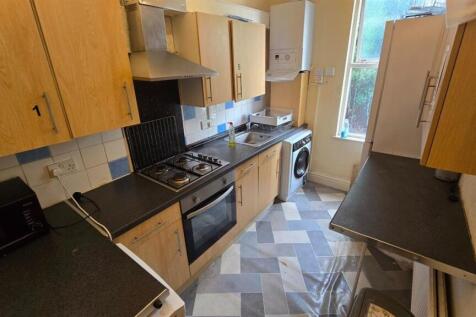 Long galley kitchen with modern appliances, amp...
