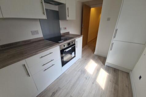 Bright and modern kitchen with ample natural li...