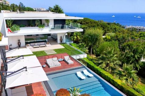 Modern villa with a luxurious pool overlooking a s