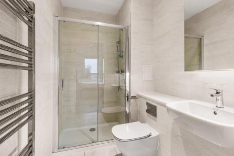 Step into elegance with this impeccably designed modern bathroom, featuring style and functionality.