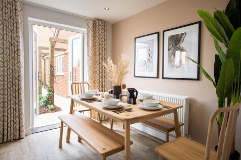 The dining area features french doors to the garden