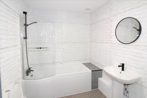 Bathroom with a shower over the bath