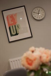 Stylish communal area with framed modern wall a...