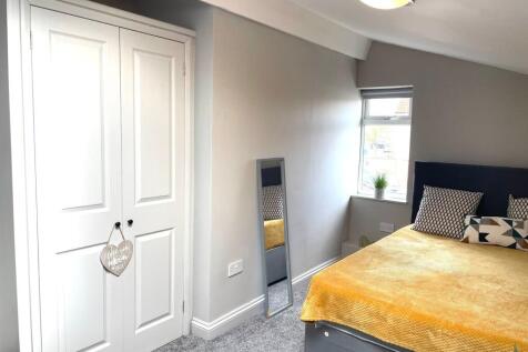 Bright and inviting master bedroom featuring a ...