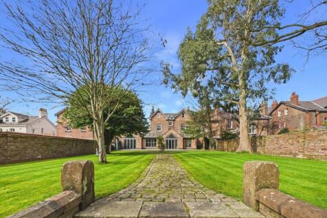 A period detached property enjoying sympathetic extensions amidst substantial grounds.