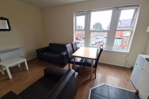 Bright and inviting living room with large wind...