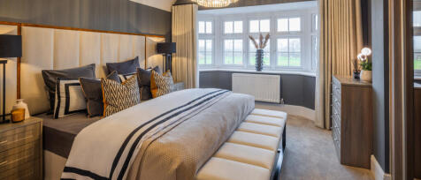 The Hampstead main bedroom with a bay window, en-suite, wardrobes all in a neutral tone