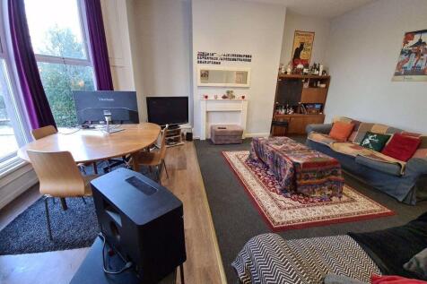 A spacious and inviting living room featuring c...