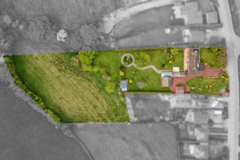 Aerial view of house, garden and land
