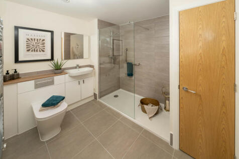 Typical ensuite with additional storage cupboard