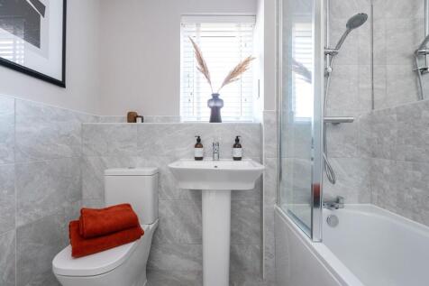 Family bathroom with shower over bath - typical Taylor Wimpey home