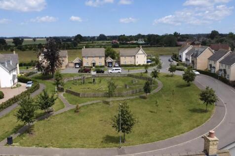 Green At Front Of Property & Surrounding Area