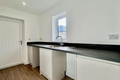 Utility with space for a washing machine and tumbl