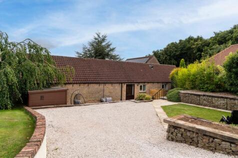 Ample parking at the back and front with beautiful landscaping