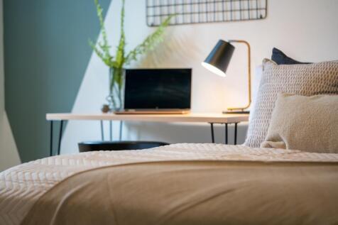 A stylish and inviting double bedroom featuring...