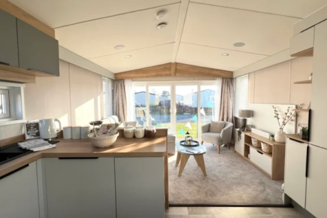 Open Plan Kitchen And Lounge With Large Front Wind