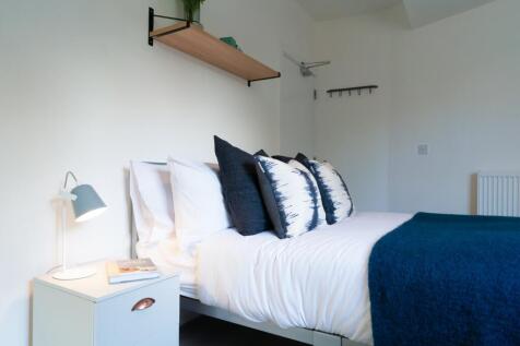 A bright and stylish double bedroom, perfect fo...