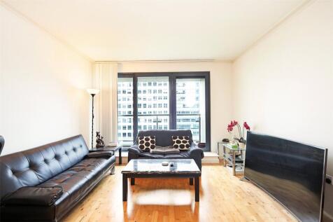 An exceptional dual aspect, water facing, two bedroom, two bathroom high specification modern apartment with private balcony and stunning water views located within Discovery Dock, a landmark modern d