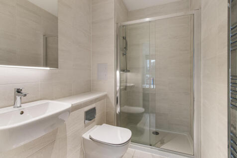 Step into this elegantly designed bathroom with high-end finishes.