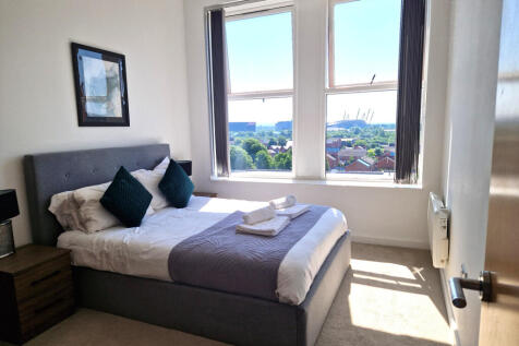 Discover modern living in this 2-bedroom, 2-bathroom apartment located in Victoria Mill, Manchester M40. With elegant wooden flooring and a fitted kitchen, this residence offers a seamless lifestyle.