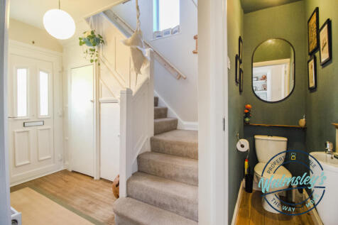 Entrance hallway with dog leg staircase & landing