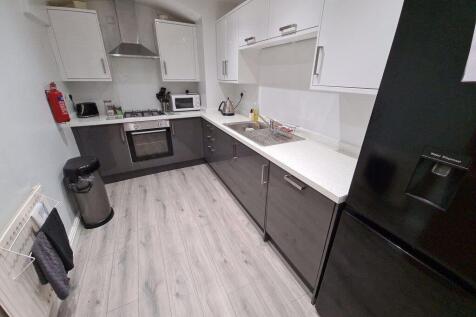 Modern, well-maintained kitchen with ample work...