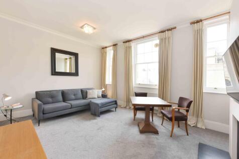A modern and contemporary two double bedroom and two bathroom apartment, on the fourth floor (with lift access) in a charming portered building on Dukes Lane, Kensington.
