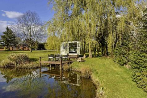 pond with shepherds hut