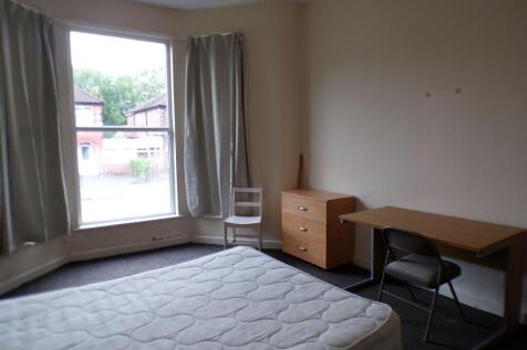 Bright front-facing double bedroom with a large...