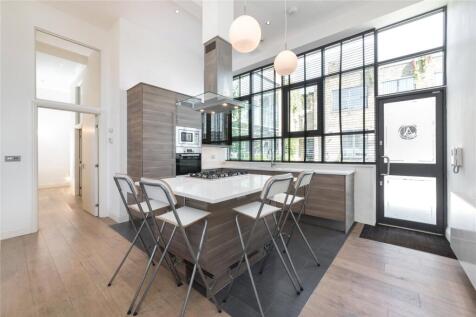 *VIDEO TOUR AVAILABLE*. A delightful 3 bedroom ground floor apartment set within a private gated warehouse style development with wood floors and parking under separate negotiation. The property is si