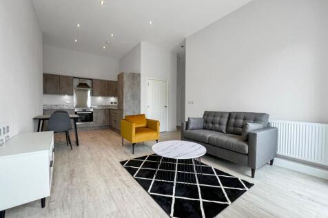 Spacious one bedroom apartment at Victoria Riverside, Leeds. Modern design, luxury finishes, open-plan living, elegant bathroom, and great location near shops, restaurants, and transport.