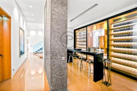 A modern, spacious interior with a sleek bar area