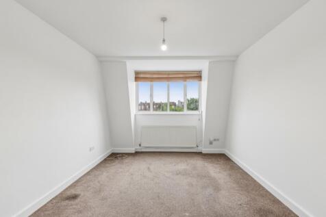 Spacious top floor three double bedroom apartment within a well kept block in a highly convenient location. NO HMO.