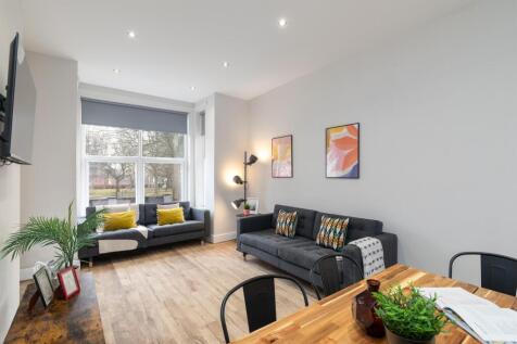 Bright contemporary living room with large fron...