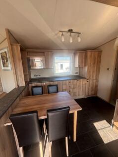 Dining Area And Extensive Kitchen Storage Inside T
