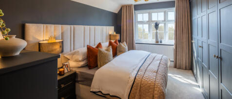 Redrow spacious bedroom with built in wardrobes, large window and double bed