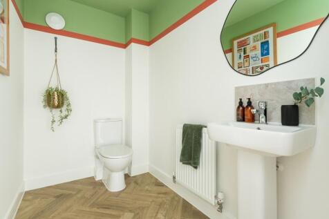 A handy downstairs cloakroom offering plenty of space for storage