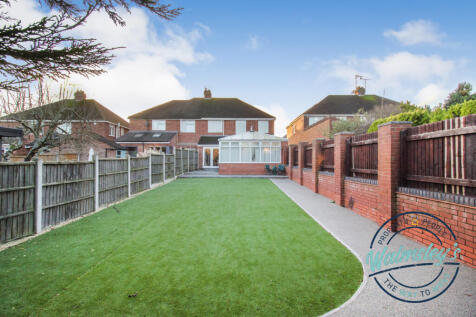 Landscaped gardens with artificial grass and resin