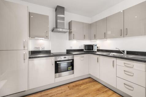 Step into a sleek kitchen where modern design meets functionality.