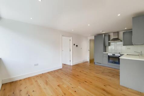 Charming 1-bed flat in bustling high street. Modern kitchen, open-plan living area, quiet 1st floor location. EPC D (68), Council Tax Band: B.