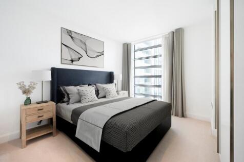 Experience tranquility in this elegantly designed bedroom with abundant natural light.