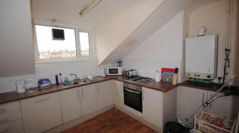 Bright and functional kitchen area with ample c...