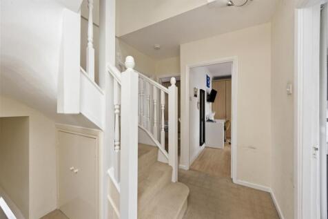 Stairs rising to Second Floor