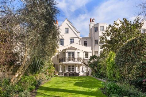 Set on Addison Road, this exceptional five bedroom house offers over 3,500 square feet across beautifully arranged living space. The raised ground floor offers open-plan entertaining space with a form
