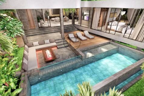 A modern outdoor space featuring a stylish pool wi