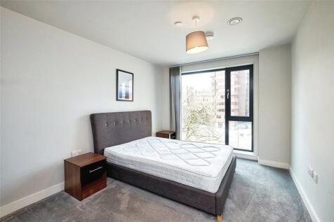 Spacious 2-bed apartment in a modern development. Features open-plan kitchen/living area, 2 bathrooms, and balcony with stunning city views. Residents enjoy access to communal gardens and on-site gym.