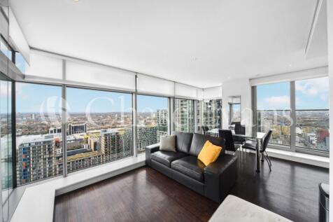 A two bedroom, two bathroom apartment with dock views and a private balcony set within the East Tower of Pan Peninsula. Features including a bright living room with full height windows, wood flooring,