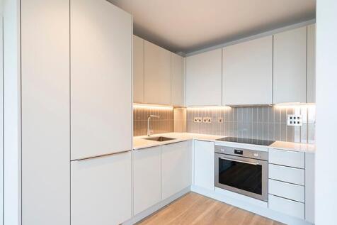Experience culinary elegance in this sleek modern kitchen, designed for the sophisticated chef.