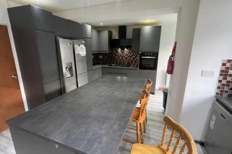 Modern kitchen with a long island breakfast bar...